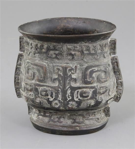 A Chinese archaic bronze ritual wine cup, Zhi, late Shang/early Western Zhou dynasty, 11th century B.C., 12.5cm, rim probably altered